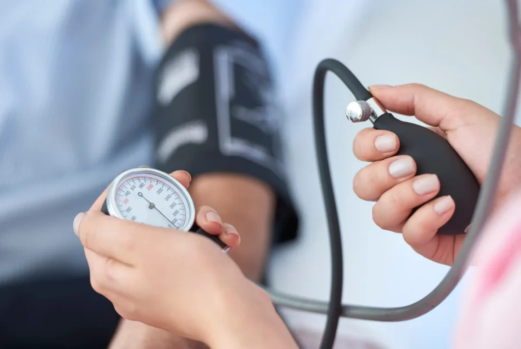 Clinician taking blood pressure from a client at P4 Movement in Wollongong