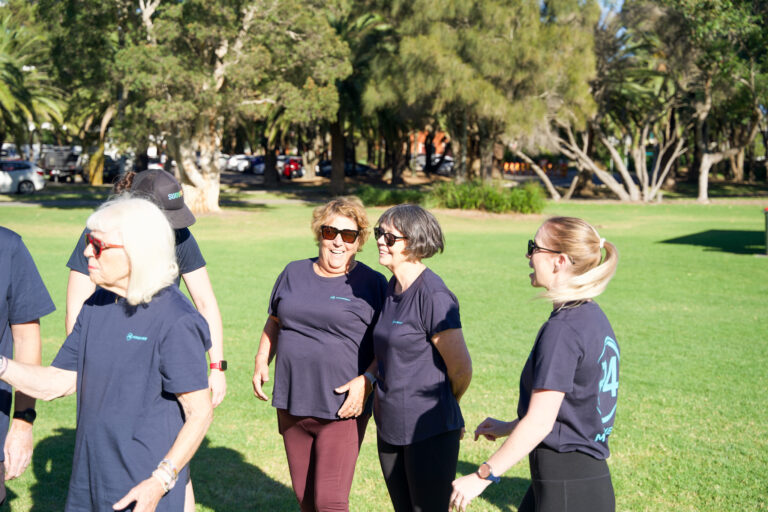 A women standing with her friend referring her to P4 Movement in Wollongong