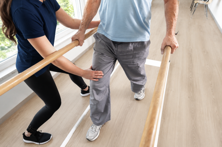 Physio helping someone with a Functional Neurological disorder to recover at P4 Movement